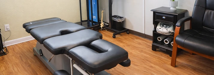 An adjustment table inside a treatment rom at Aranibar Chiropractic